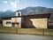 Abandoned factory front view in the valley. Glimpse of Biasca in Switzerland