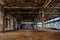 Abandoned factory. Large empty industrial hall waiting for demolition