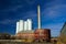 Abandoned Factory with Storage Tanks, Smokestack, and an Agriculture Grain Elevator Silo in the Background