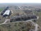 Abandoned farm, aerial view. Dilapidated industrial buildings