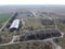 Abandoned farm, aerial view. Dilapidated industrial buildings