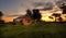 Abandoned farm house at sunset