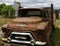 Abandoned Farm Truck Against Grain Elevator