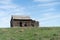 abandoned farmhouse barn on field in Alberta