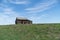 abandoned farmhouse barn on field in Alberta