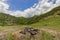 Abandoned fireplace campsite under blue sky