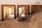 Abandoned and forgotten building and room left by people and being taken over by encroaching sandstorm, Kolmanskop ghost