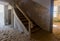 Abandoned and forgotten building and room left by people and being taken over by encroaching sandstorm, Kolmanskop ghost