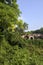 Abandoned fortification behind a hedge and a fence in a park in the italian countryside