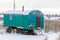 Abandoned frozen trailer or wagon covered snow outdoor in winter day