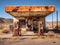 Abandoned gas station in desert landscape