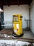 Abandoned gas station with yellow pump