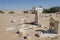 Abandoned graveyard with crumbling stones and crosses in Namib Desert of Angola