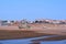 Abandoned green color boat on Hendaye France beach at low tide