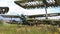 Abandoned green small propeller plane. Airplane graveyard