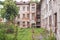 Abandoned grunge red brick building with boarded up windows