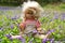 Abandoned Grungy Doll In Flowers