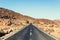 Abandoned highway in desert landscape - vintage style