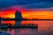 Abandoned hotel Parus in Dnipro city Ukraine against the background of sunset. Evening cityscape with a skyscraper on the