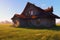 Abandoned house in countryside. Desolate residential building in nature.