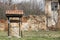 Abandoned house and an old draw well near it