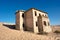 Abandoned house in sand