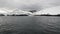 Abandoned house Water surface and desert snow coastline in ocean of Antarctica.