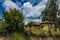 Abandoned houses in Ecuador under blue sky and white clouds