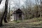 Abandoned hunting lodge in autumn forest