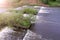 Abandoned hydroelectric power station on river waterfall with streaming current.