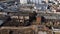 Abandoned industrial area. Old brick buildings and factory chimneys. Around a new residential city block. Aerial photography