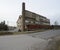 Abandoned industrial building with brick pipe