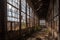 abandoned industrial complex with broken windows and rusted metal structures