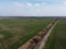 Abandoned land reclamation canal in the field, aerial view. Agricultural landscape