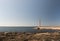 Abandoned lighthouse on a flat island