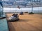 Abandoned Luna Park. Autodrom. Cars are covered with tarpaulins. Old carousels. Does not work. Broken attraction. resort in winter