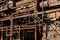 Abandoned manufacturing facility structure, rusted pipes and tubes