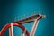 Abandoned metal diving structure. Iconic industrial and sports architecture, white and red steel elements on a deep blue clear sky