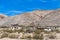 Abandoned mining town at the base of a mountain