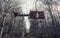 Abandoned mountain Ski Lift in the forest with wood chairs