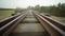 Abandoned narrow gauge railway on the bridge over raod, autumn day