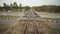 Abandoned narrow gauge railway on the bridge over raod, autumn day