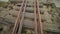 Abandoned narrow gauge railway on the bridge over road, autumn day