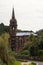 Abandoned Neogothic Chapel of Nossa Senhora das Vitorias at Furnas Lake bank in misty day, Sao Miguel, Azores