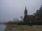 Abandoned Neogothic Chapel of Nossa Senhora das Vitorias at Furnas Lake bank in misty day, Sao Miguel, Azores, Portugal