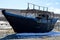 Abandoned North Korean fishing schooner on the shore of the Sea of â€‹â€‹Japan, Primorye, Russia.