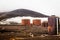 Abandoned norwegian whale hunter station rusty blubber tanks panorama at Deception island, Antarctic