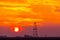 Abandoned oil and gas rig profiled on dramatic evening sky