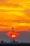 Abandoned oil and gas rig profiled on dramatic evening sky