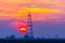 Abandoned oil and gas rig profiled on dramatic evening sky